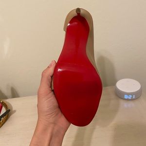 Christian Louboutin rubber soul red bottom.